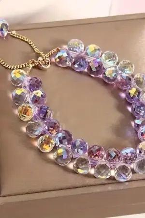 Pulcera Cristal artificial blanca tornasol y lila