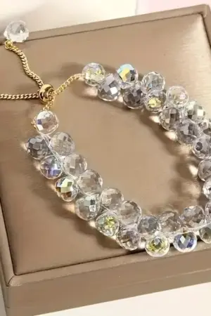 Pulcera Cristal artificial blanca tornasol