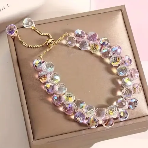 Pulcera Cristal artificial blanca tornasol y rosa